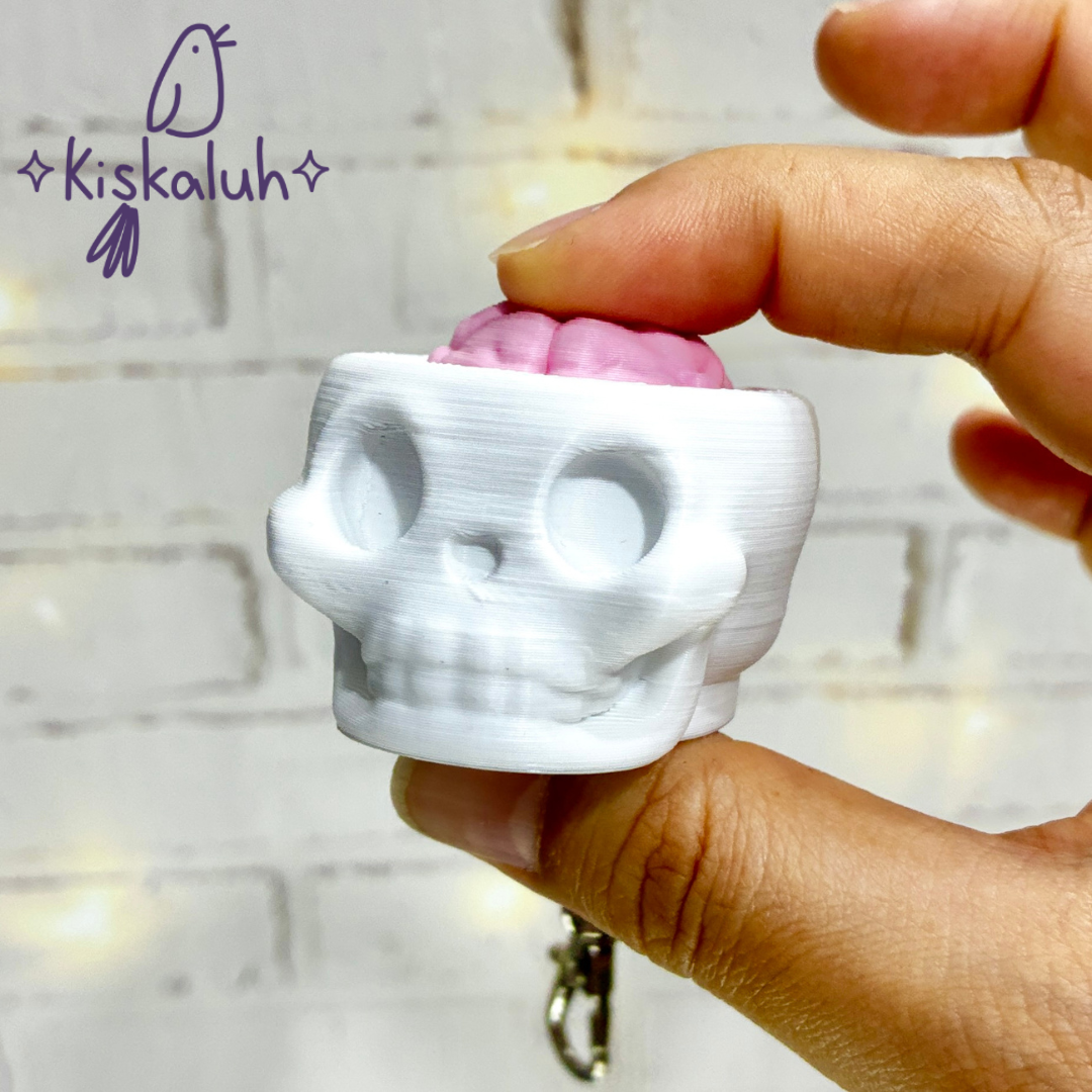 Craneo clicker, llavero fidget